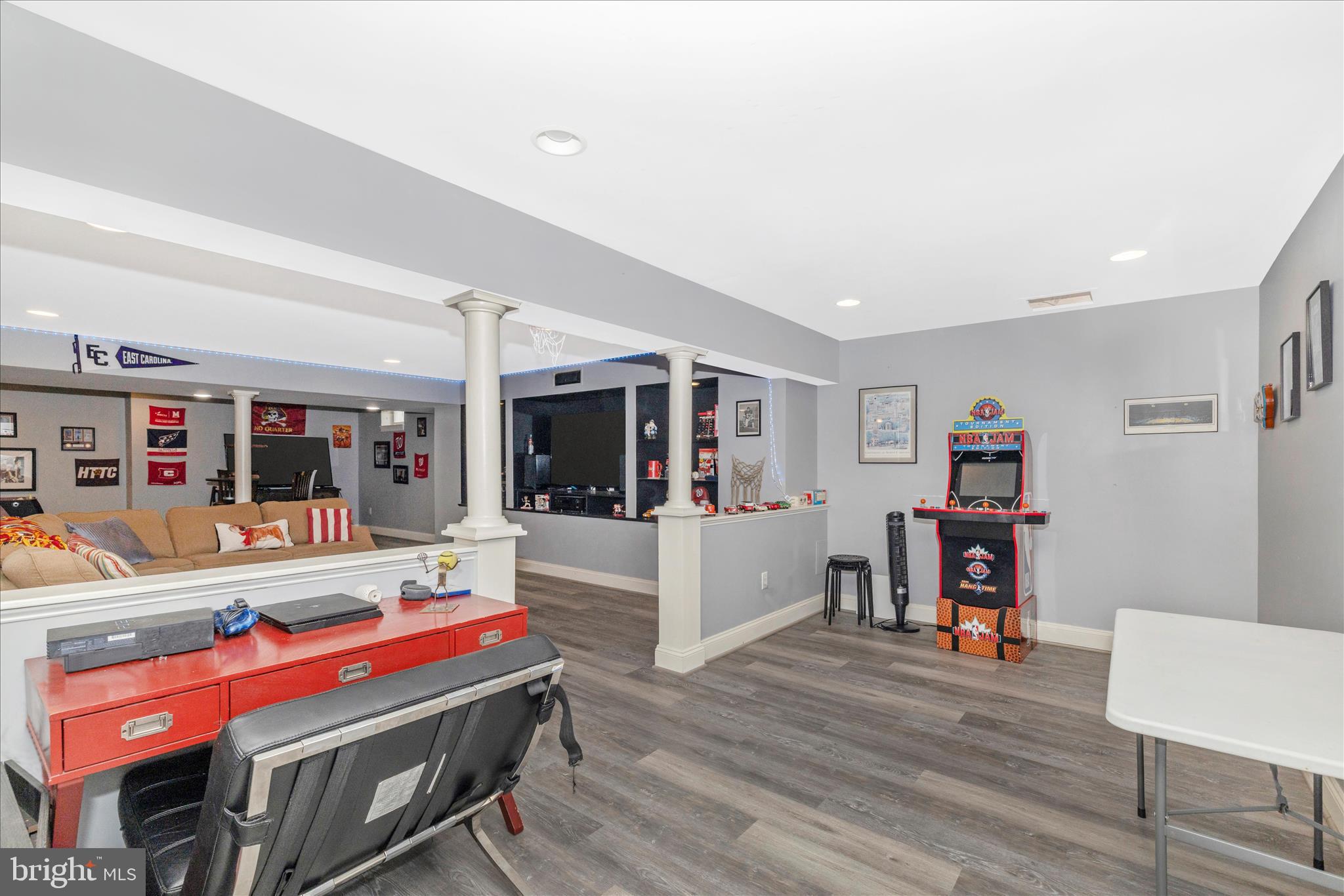11306 Country Club Road New Market, MD 21774 - Photo 43 of 77 a living room with furniture a flat screen tv and gym equipment