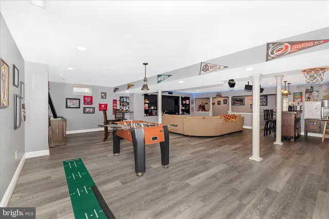 a view of a house with a yard and large tree