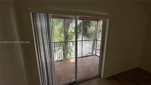 a view of a glass door and a window