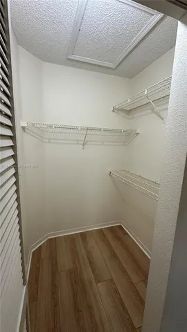 a view of a room with racks on the wall