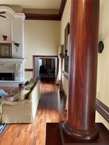 a view of a livingroom with furniture and a window