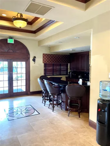 a living room with furniture fireplace and a window