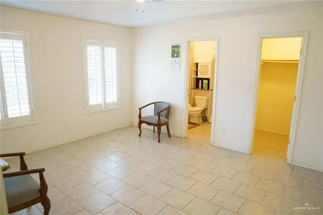 a view of a livingroom with furniture and a window
