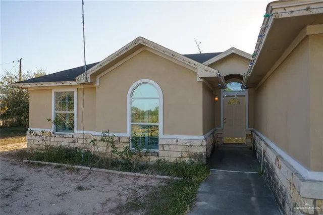 a view of a house with a small yard