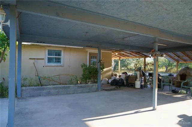 a view of backyard with wheel chair and potted plants