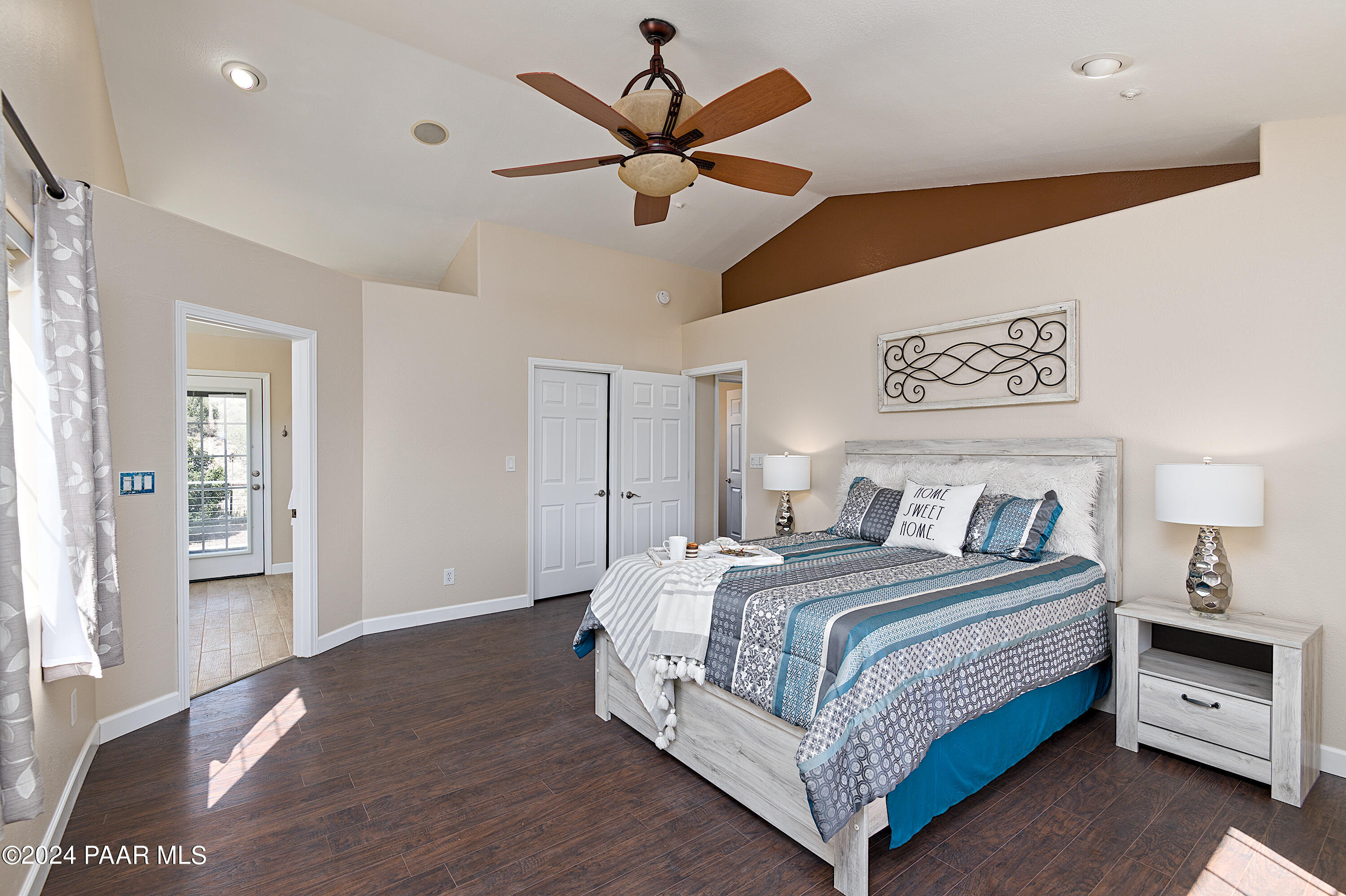 4860 West Stazenski Road Prescott, AZ 86305 - Photo 22 of 67 a bedroom with a bed and a ceiling fan