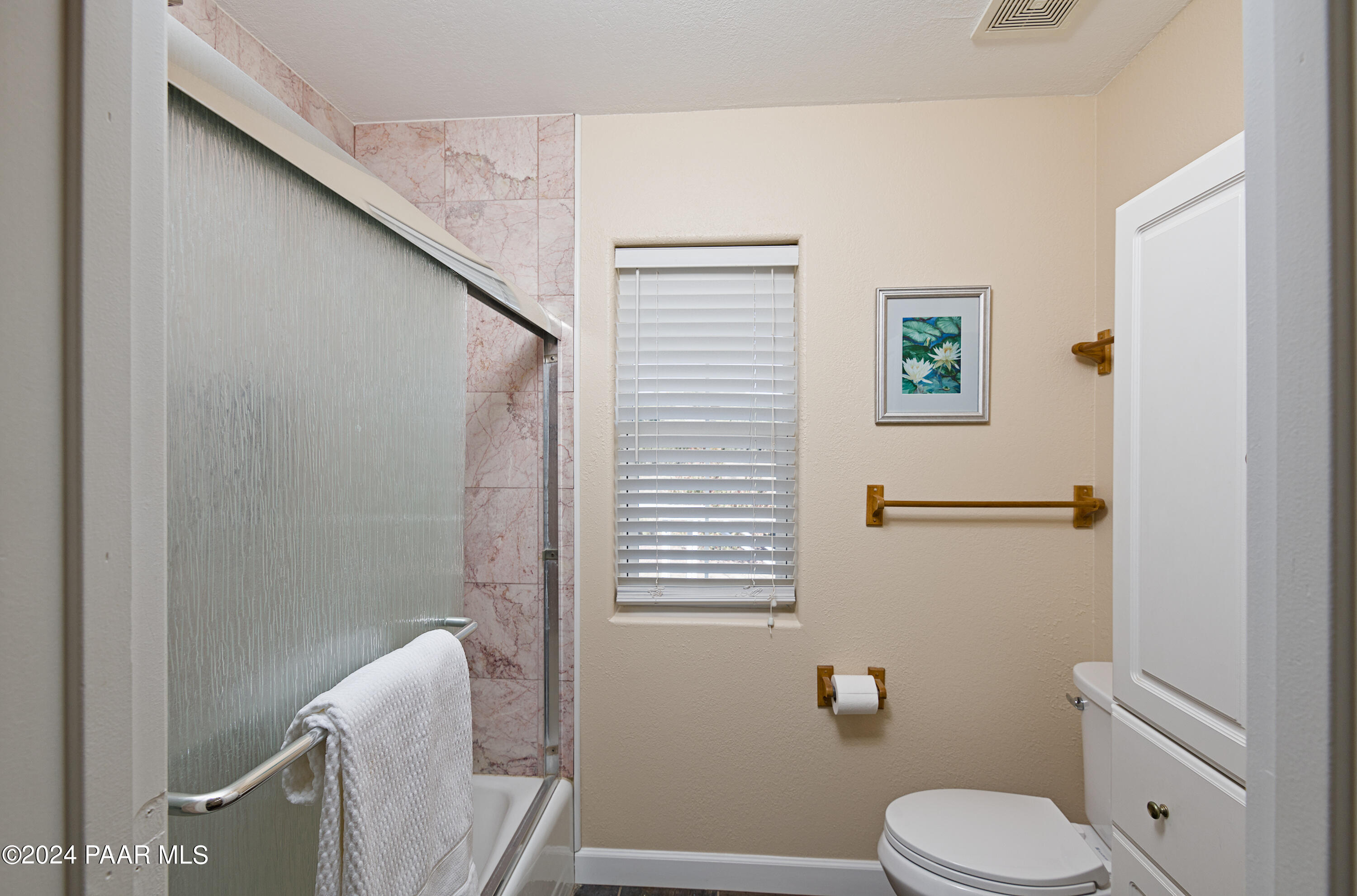 4860 West Stazenski Road Prescott, AZ 86305 - Photo 33 of 67 a bathroom with a toilet a sink and mirror