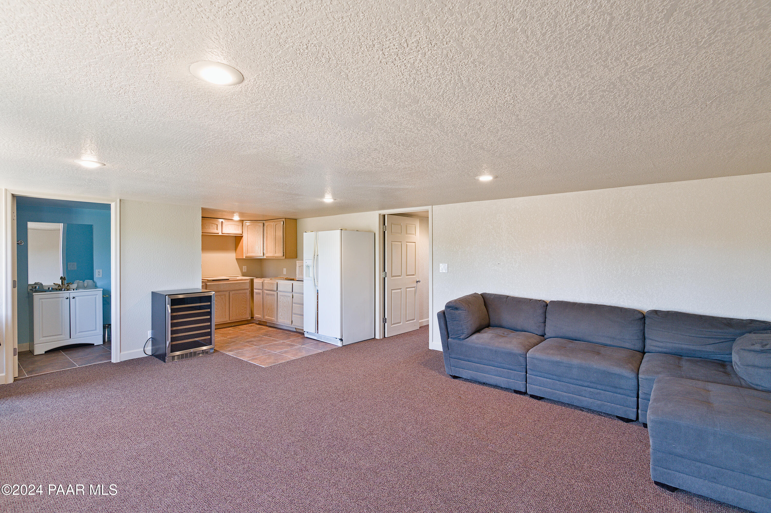 4860 West Stazenski Road Prescott, AZ 86305 - Photo 47 of 67 a living room with furniture and a walk in closet