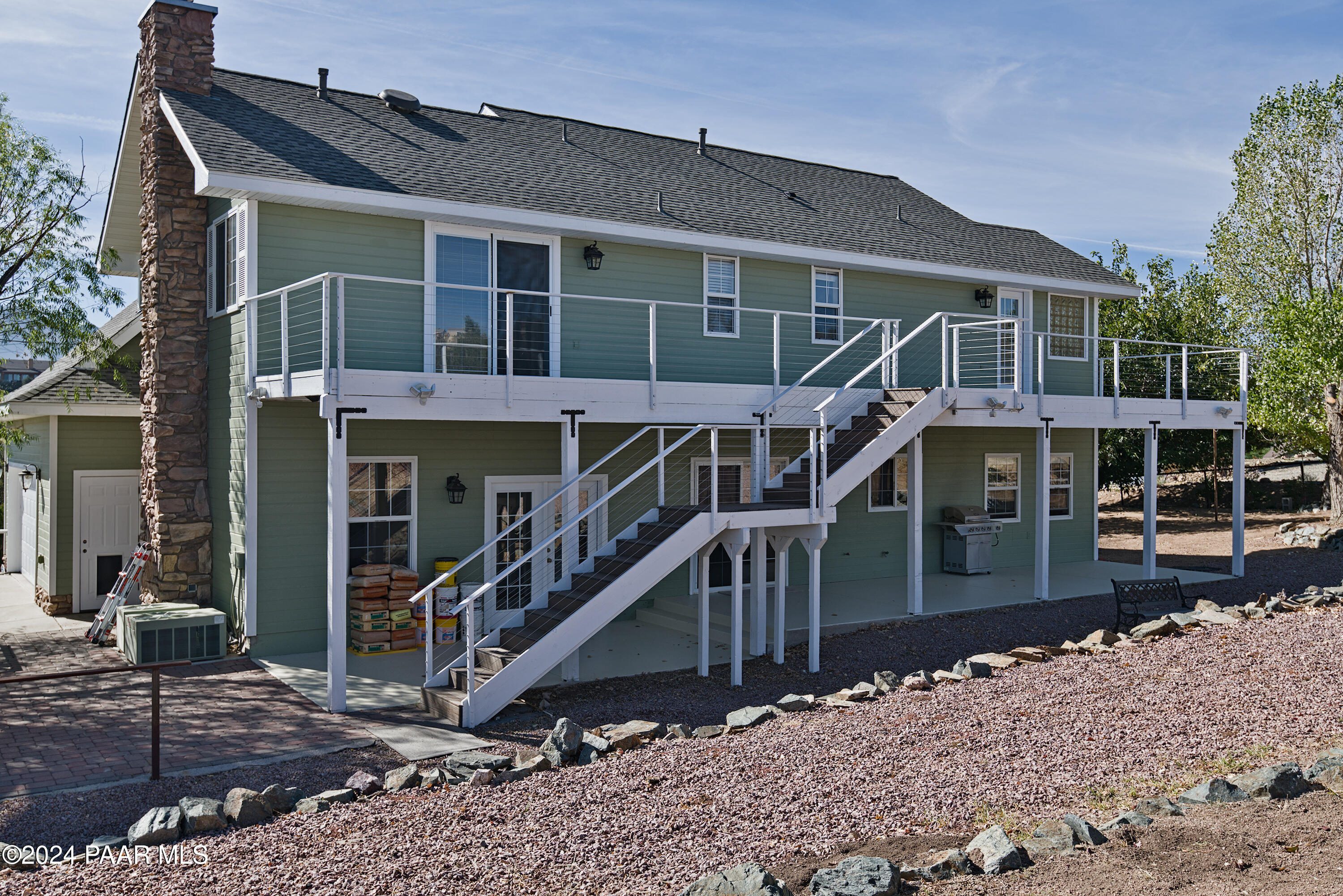 4860 West Stazenski Road Prescott, AZ 86305 - Photo 53 of 67 a front view of a house with glass windows and a view