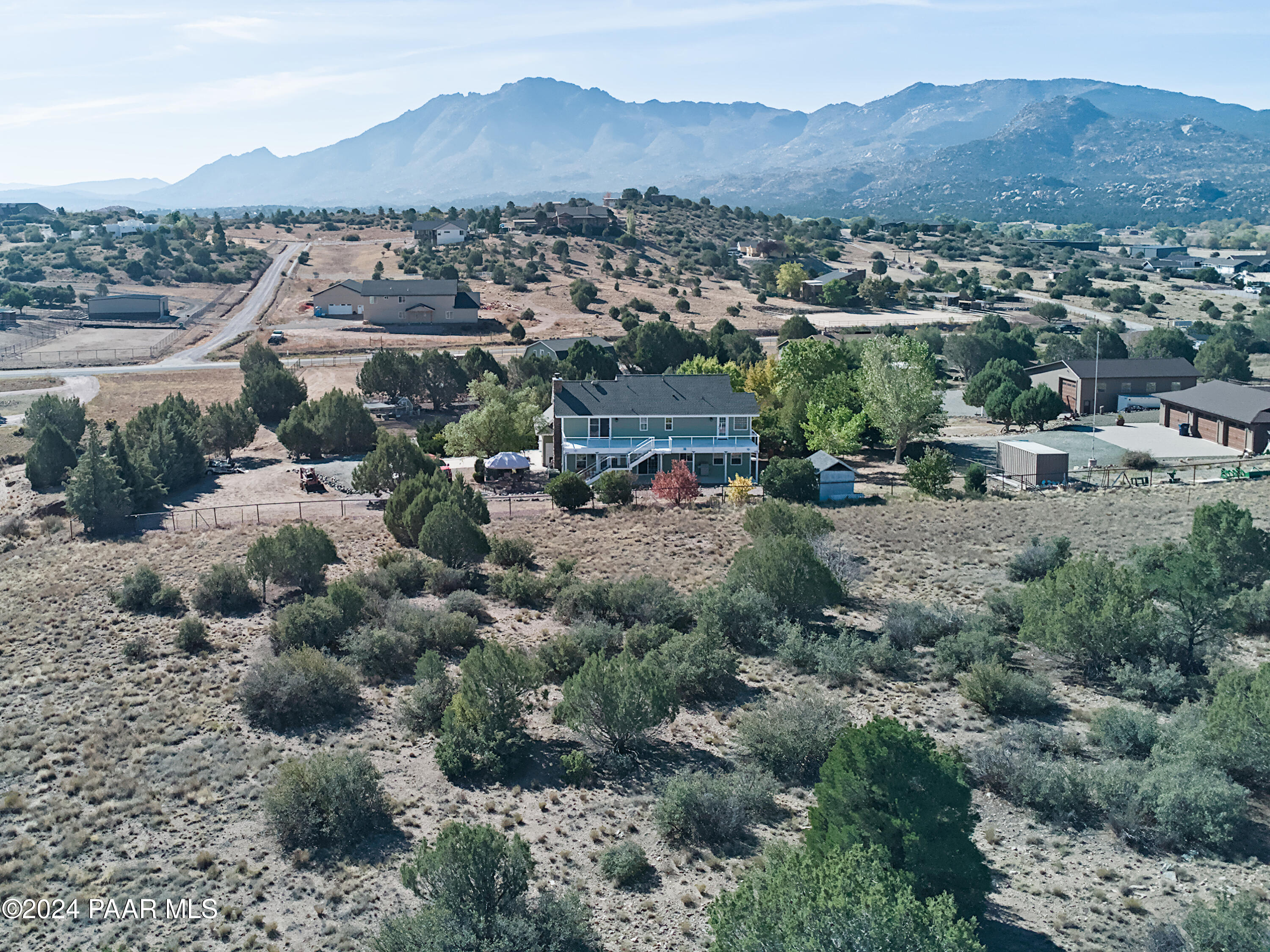 4860 West Stazenski Road Prescott, AZ 86305 - Photo 61 of 67 a view of a house with a mountain and a forest