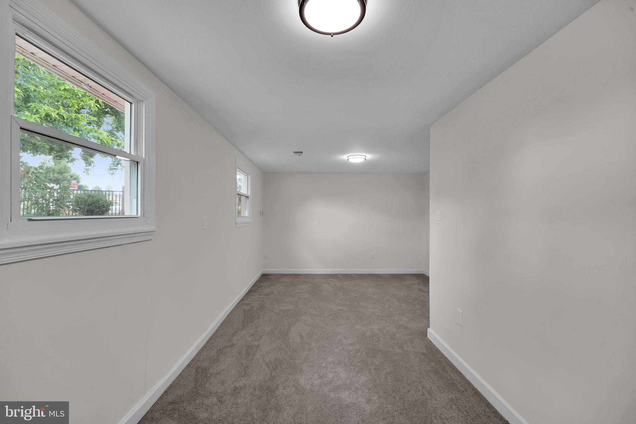 8613 Weems Road Manassas, VA 20110 - Photo 22 of 50 a view of an empty room with a window