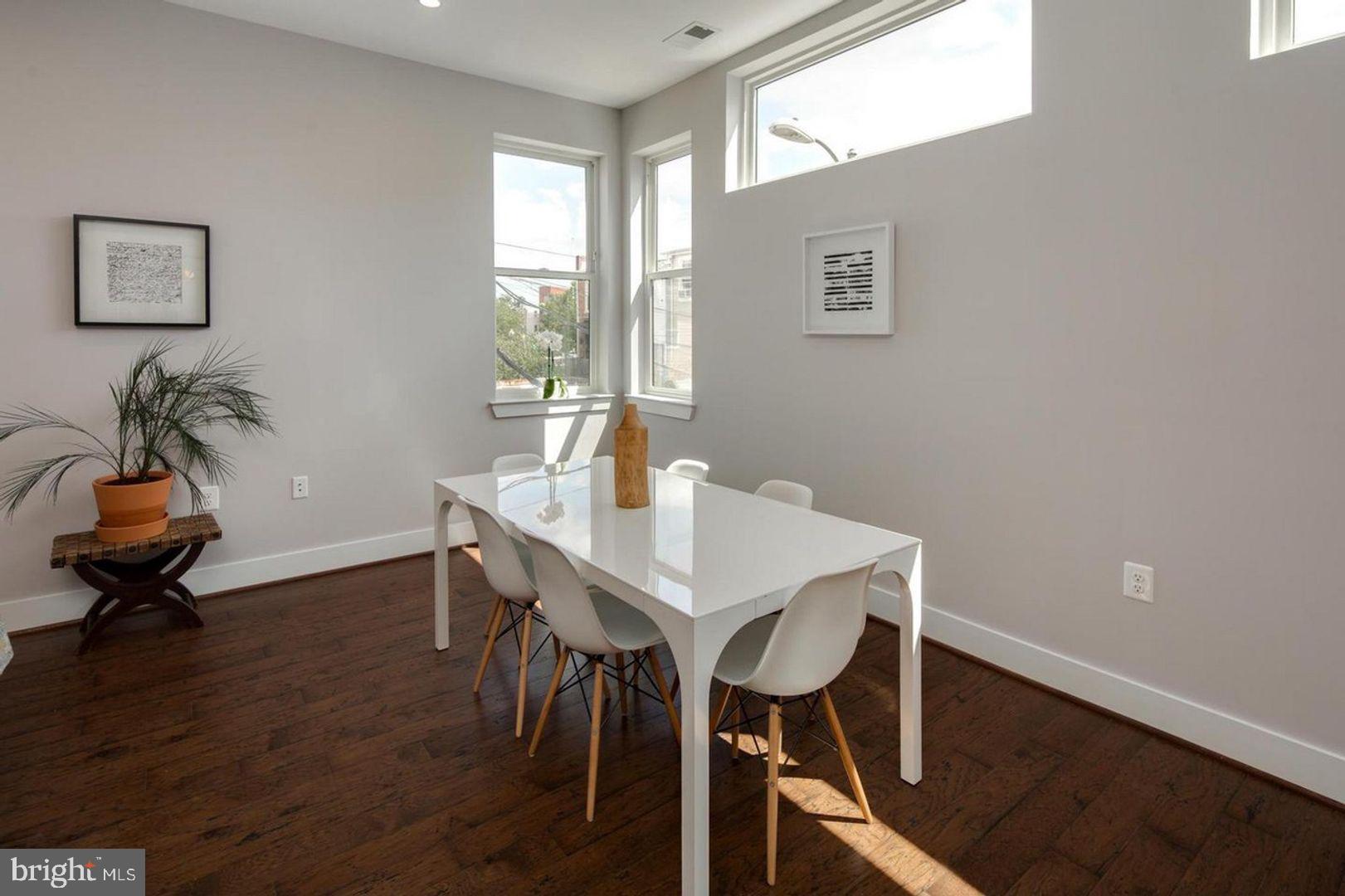 3542 Warder Street Northwest, Unit 204 Washington, DC 20010 - Photo 13 of 29 a living room with furniture and a window