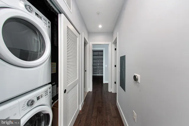a view of a hallway with washer and dryer