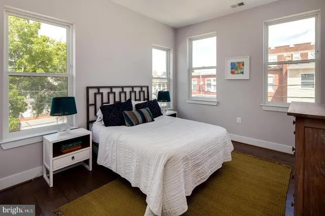 a bedroom with a bed and window