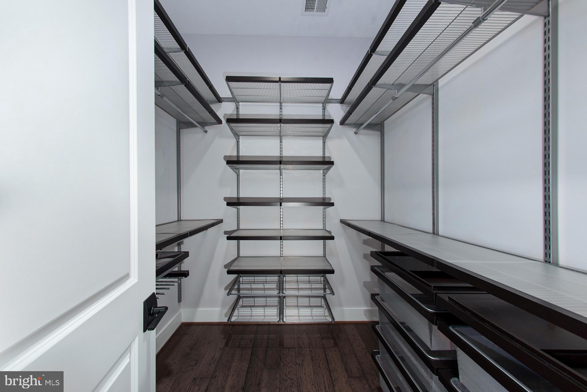 3542 Warder Street Northwest, Unit 204 Washington, DC 20010 - Photo 17 of 29 a view of a room with racks on the wall