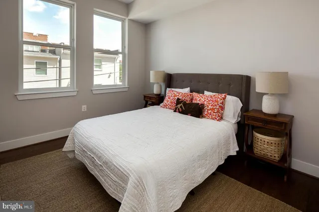 a bedroom with bed and window