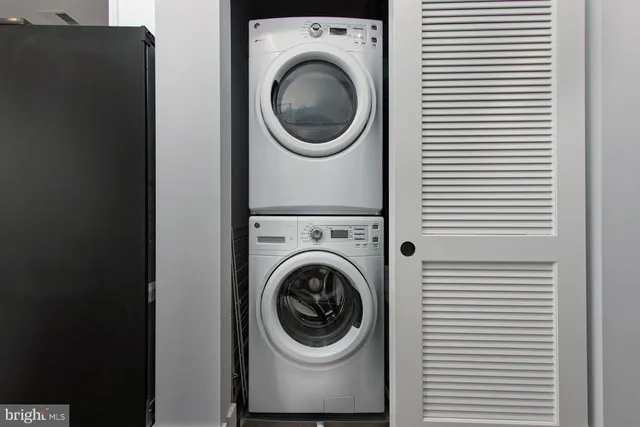 a view of a hallway with washer and dryer