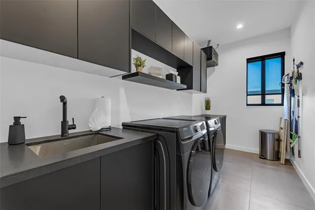 a very nice looking dining room with a large window and couch