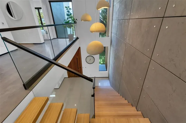 a bathroom with a sink toilet a mirror and shower