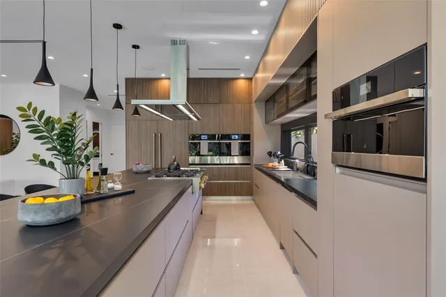 a bedroom with a large bed and a large window