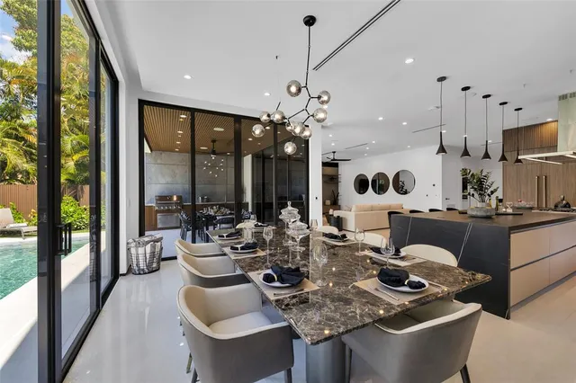 a spacious bedroom with a bed and a potted plant