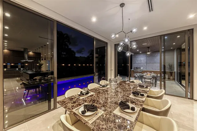 a spacious bedroom with a bed and a television