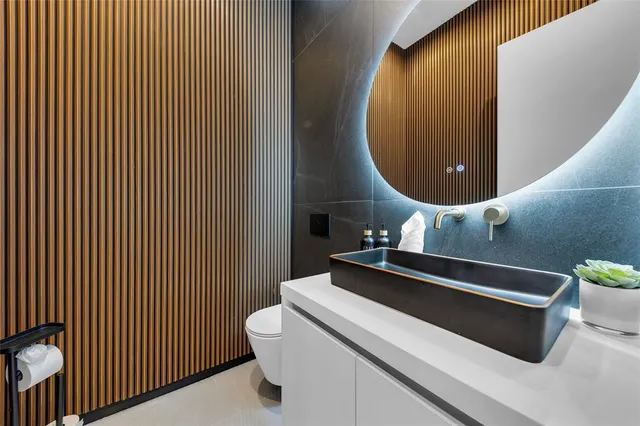 a bedroom with bed tv and flat screen tv