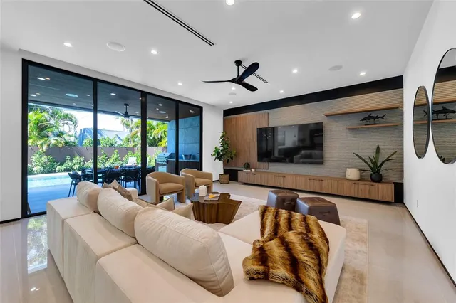 a view of a patio with table and chairs and potted plants