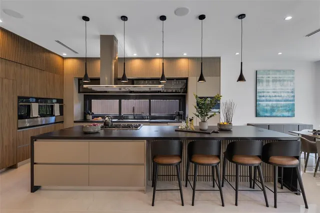 a bedroom with a large bed and a night stand