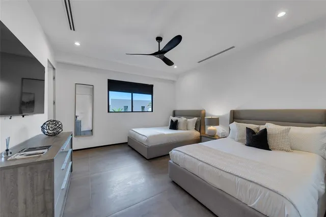 a view of a backyard with plants and a garden