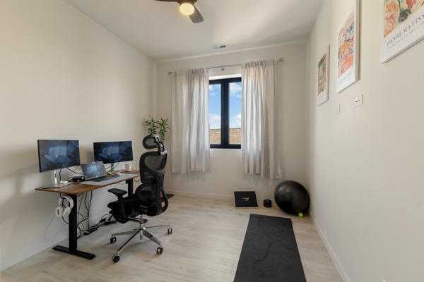 2135 West Cermak Road, Unit 3S Chicago, IL 60608 - Photo 10 of 14 a view of workspace filled with furniture and gym equipment