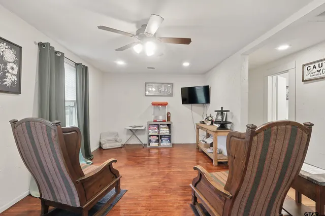 a living room with furniture and a flat screen tv