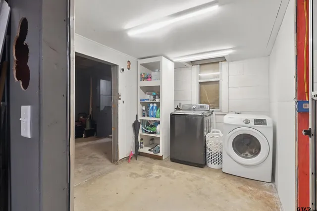 a view of a storage & utility room with washer and dryer