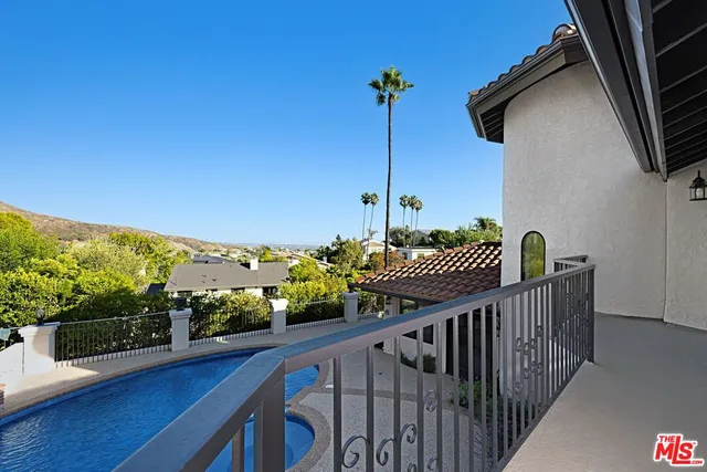 a view of a balcony with an outdoor space