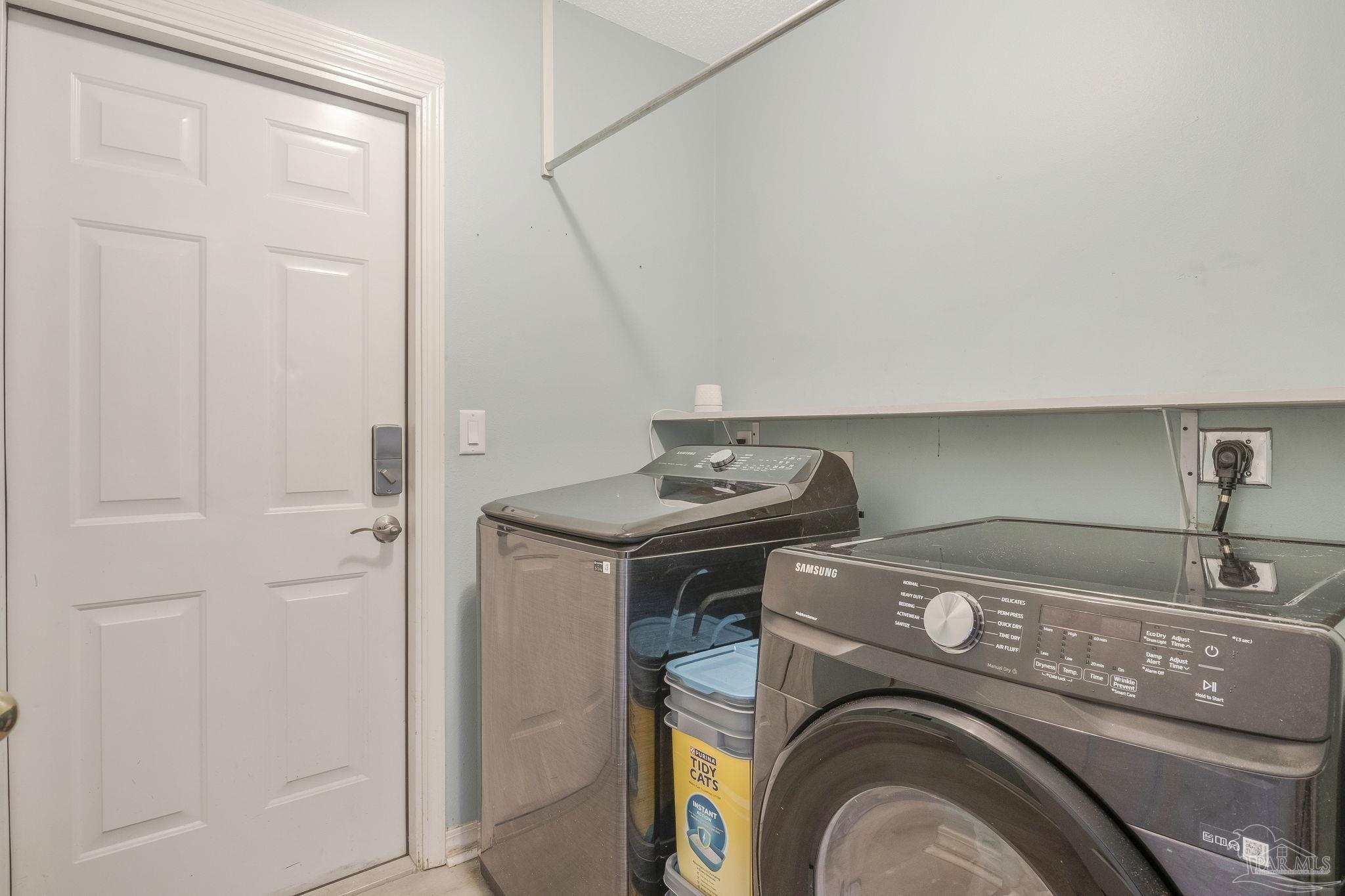 5539 Windrun Place Pace, FL 32571 - Photo 32 of 62 a utility room with dryer and washer