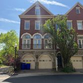 a front view of a house with parking space