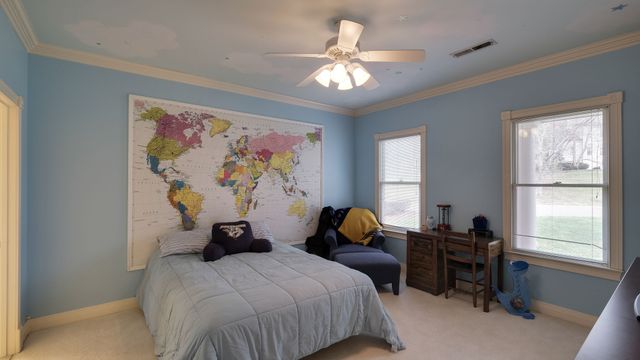 a kitchen with stainless steel appliances granite countertop a sink a stove and cabinets