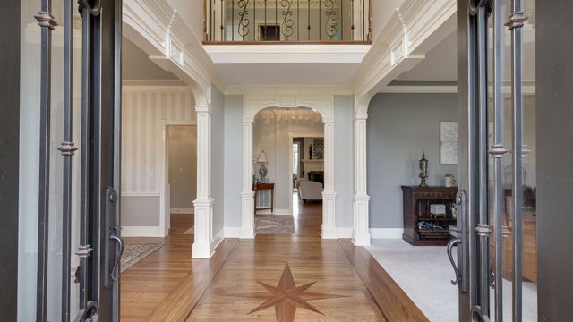 a view of a dining room with furniture and window