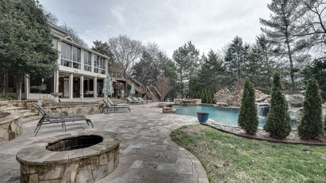 a view of a backyard with sitting area