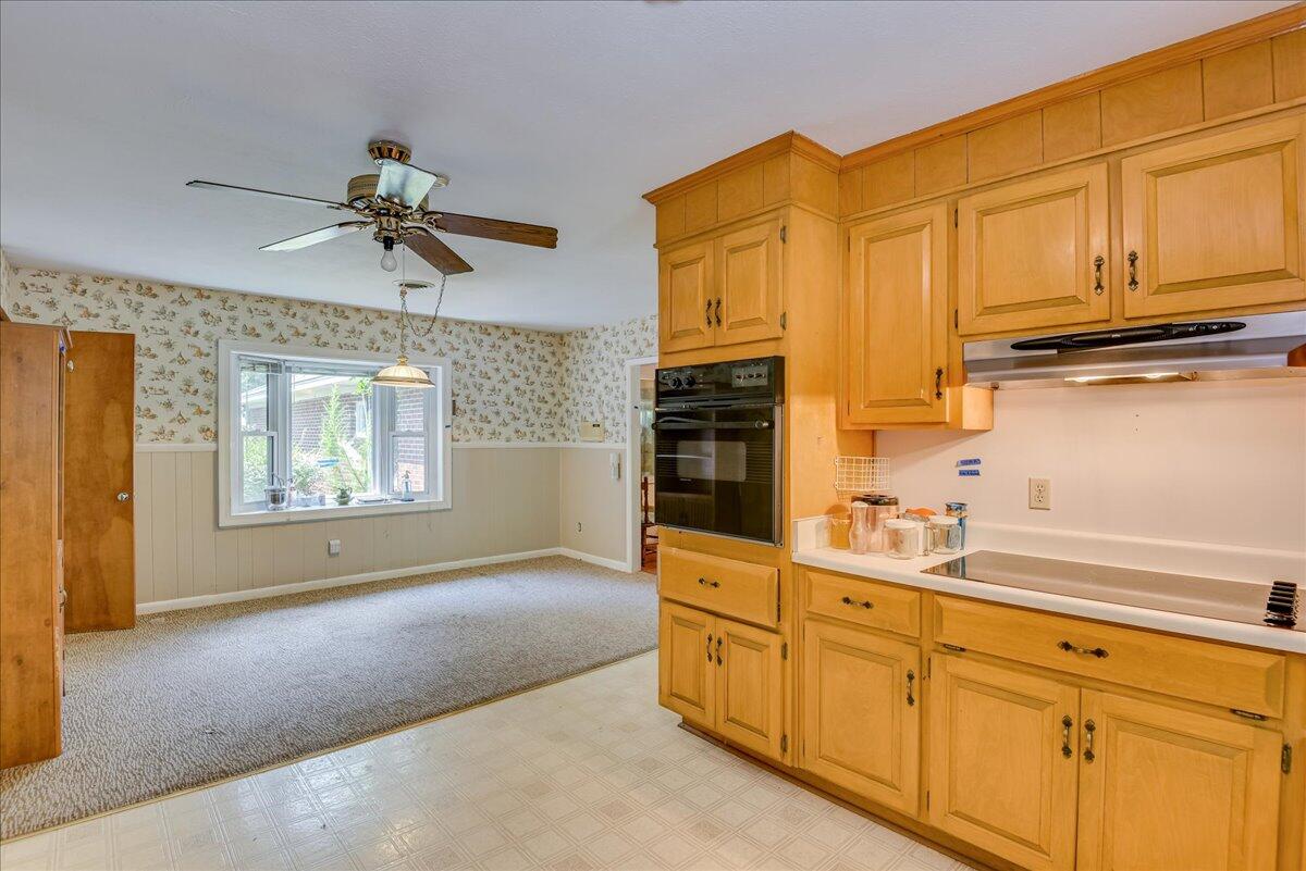 825 Brandy Road Aiken, SC 29801 - Photo 23 of 66 a kitchen with stainless steel appliances granite countertop a sink a stove and cabinets with wooden floor