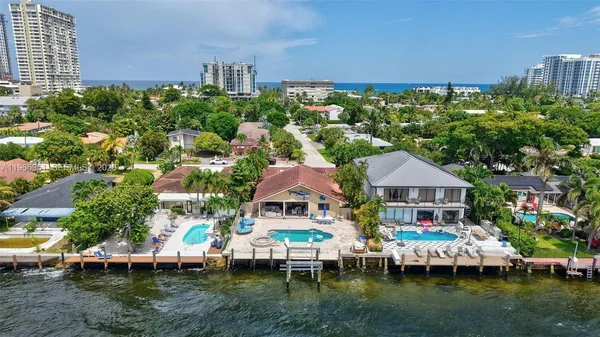 a aerial view of a house with swimming pool and deck