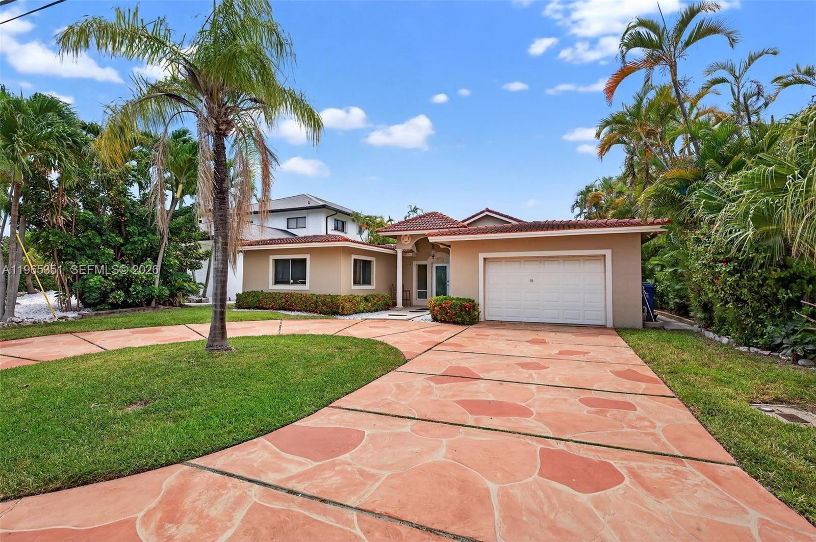 317 South Riverside Drive Pompano Beach, FL 33062 - Photo 11 of 25 a front view of house with yard and green space
