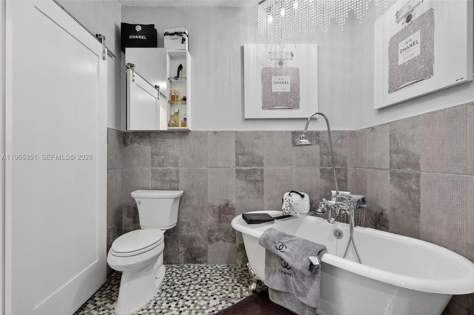 317 South Riverside Drive Pompano Beach, FL 33062 - Photo 12 of 25 a bathroom with a sink and toilet