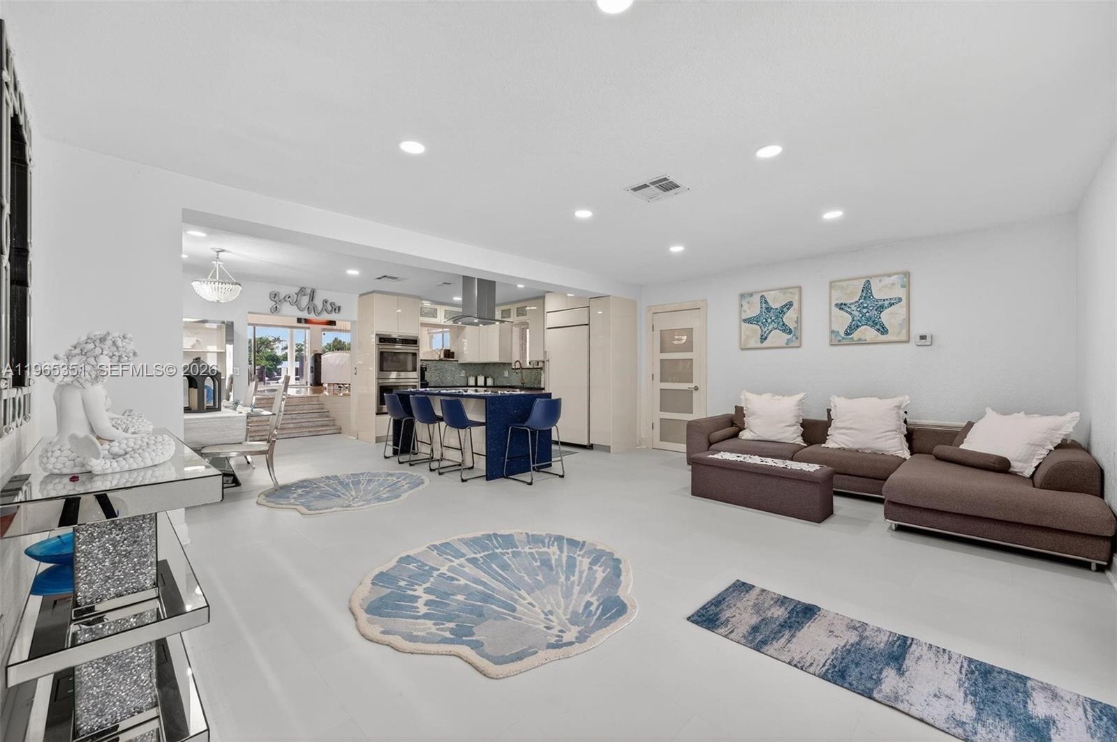 317 South Riverside Drive Pompano Beach, FL 33062 - Photo 14 of 25 a living room with furniture and a couch