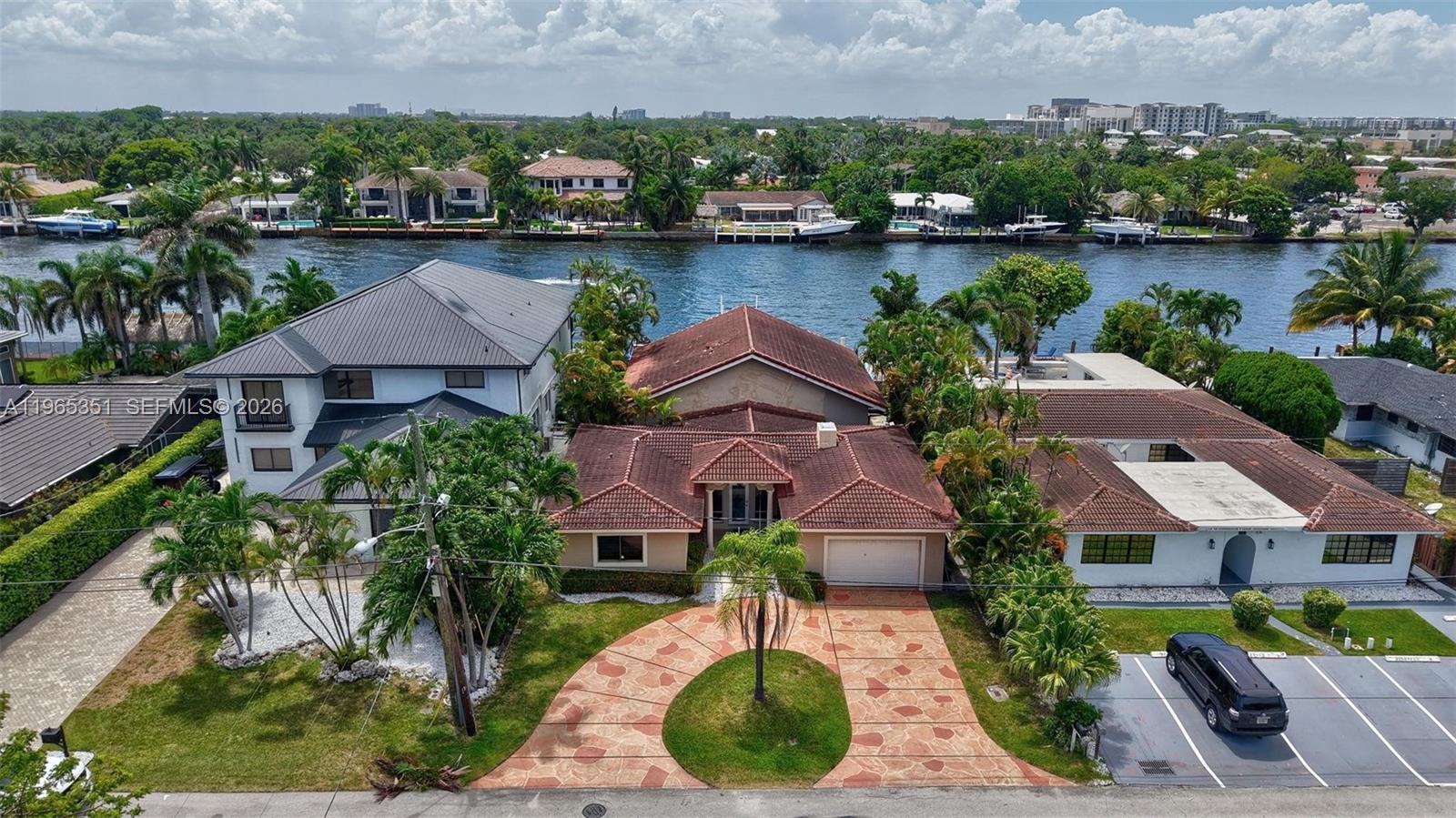 317 South Riverside Drive Pompano Beach, FL 33062 - Photo 18 of 25 an aerial view of a house with a garden and lake view