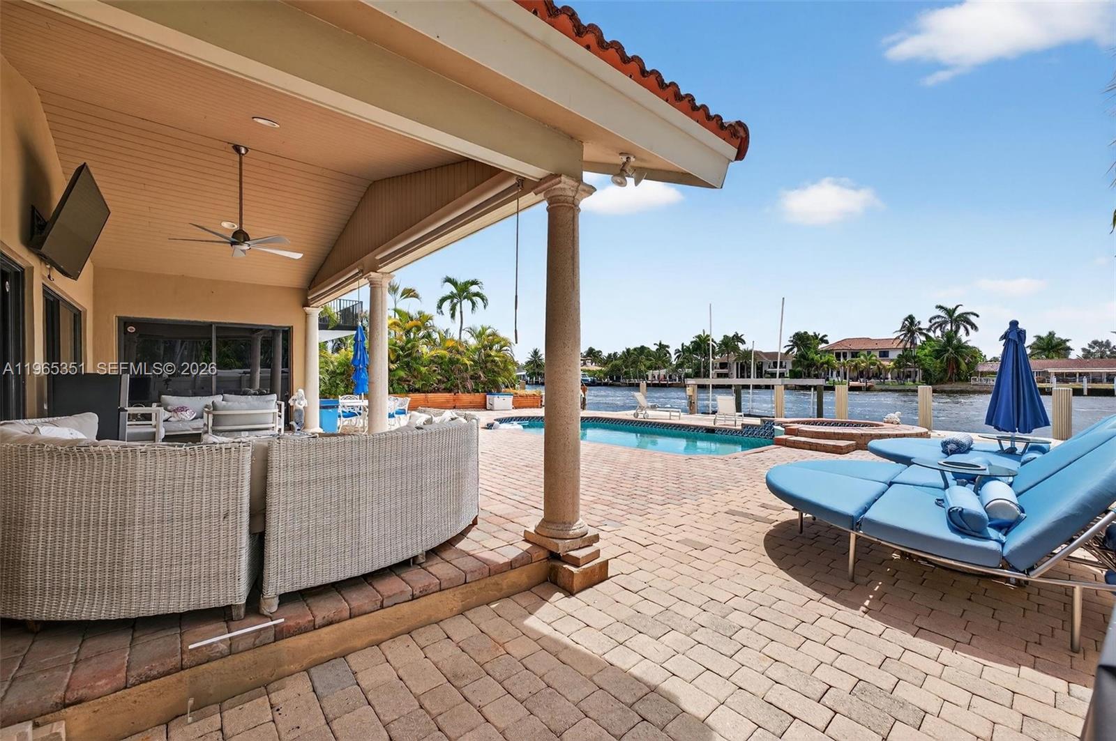 317 South Riverside Drive Pompano Beach, FL 33062 - Photo 2 of 25 a view of a patio with couches chairs dining table and chairs