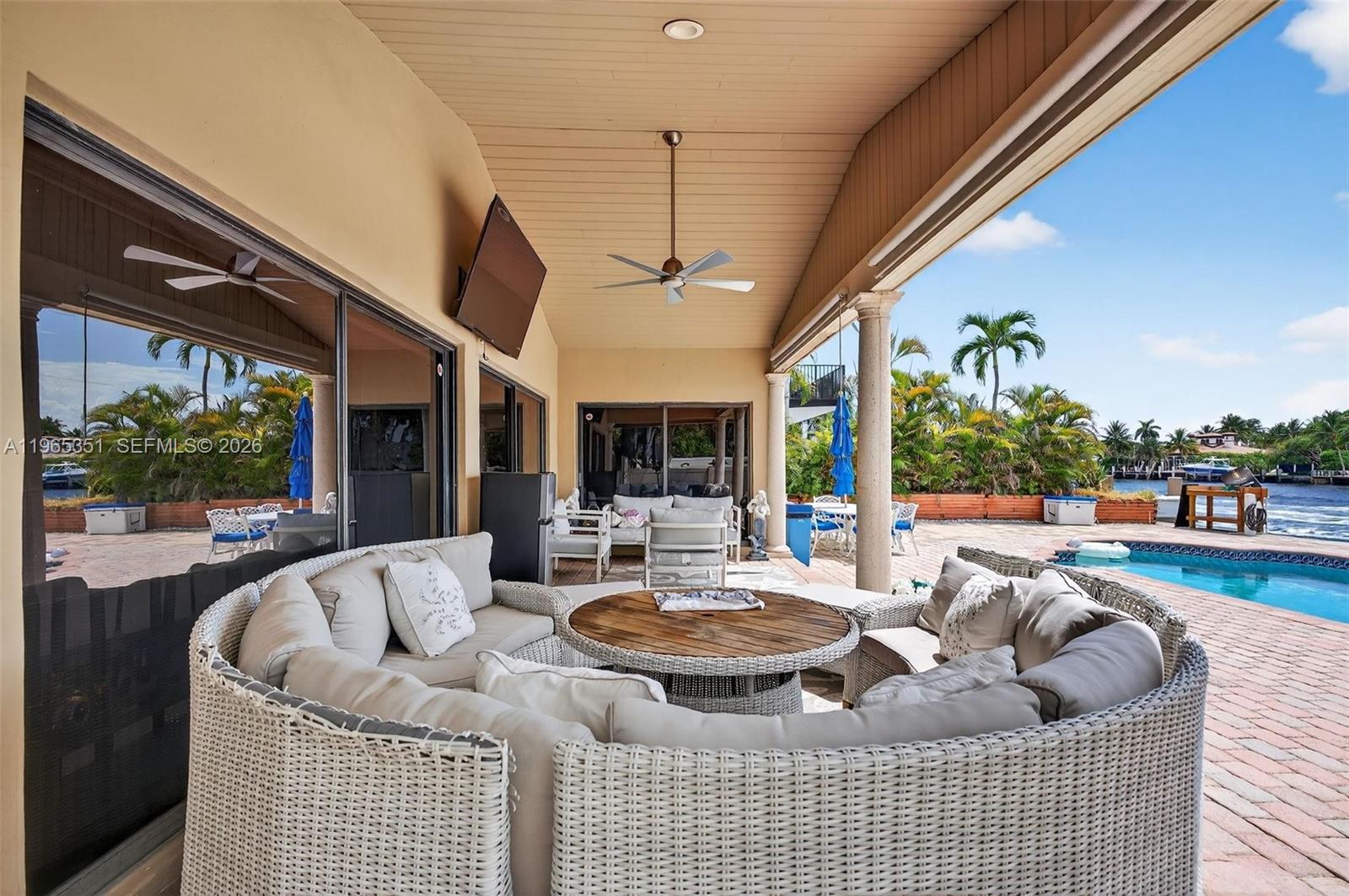 317 South Riverside Drive Pompano Beach, FL 33062 - Photo 3 of 25 a living room with furniture and a large window