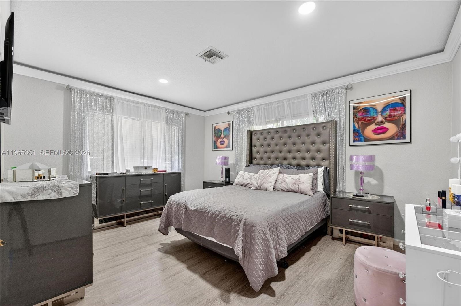 317 South Riverside Drive Pompano Beach, FL 33062 - Photo 5 of 25 a bedroom with a bed and a dresser