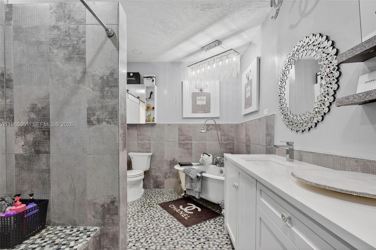 317 South Riverside Drive Pompano Beach, FL 33062 - Photo 7 of 25 a bathroom with a sink a toilet and shower