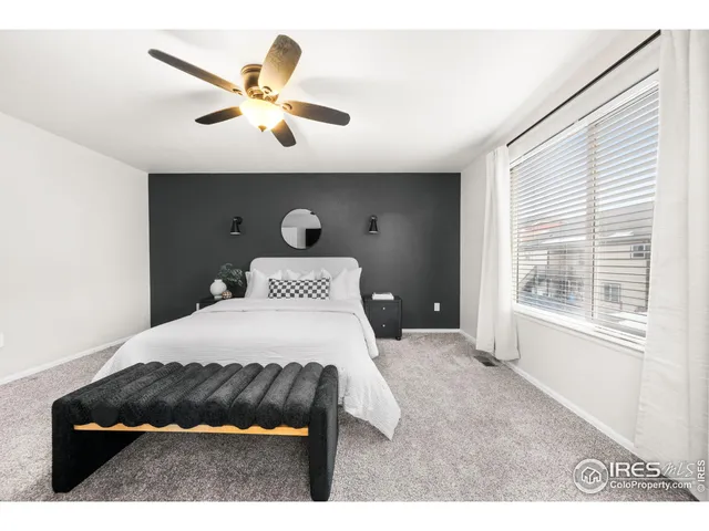 a bedroom with a bed and window